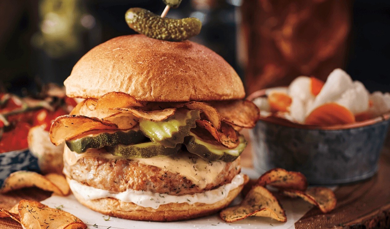 beef burger with deep fried bacon and thousand island dressing. beef burger with deep fried bacon and thousand island dressing.