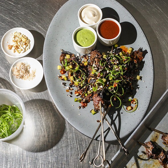 Short Rib Satay with Trio of Sauces, Pickled Cucumber & Crispy Black Rice