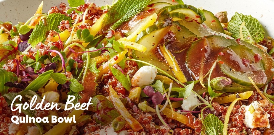 A professionally plated vegetable bowl is shown. The text reads: Golden Beet Quinoa Bowl.