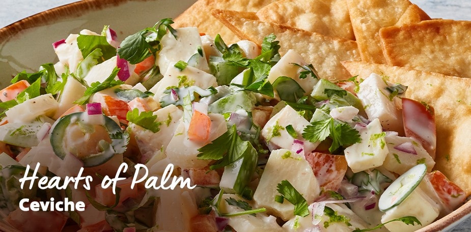 A professionally plated bowl of ceviche and chips is shown. The text reads: Hearts of Palm Ceviche.