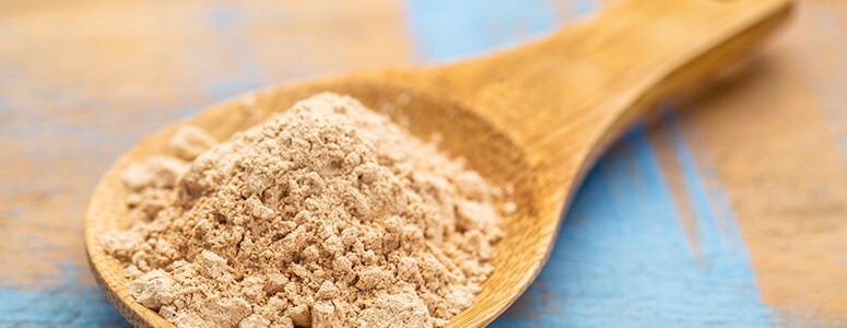 Maca root on spoon Maca root on spoon