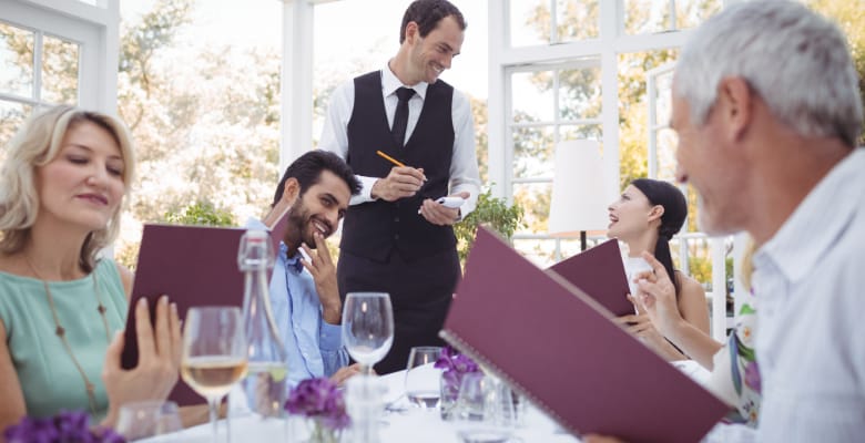 Group of people dining in a restaurant. Group of people dining in a restaurant.