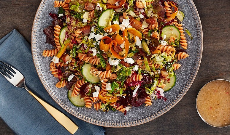 A prepared bowl of red lentil pasta offers plant based proteins full of flavors