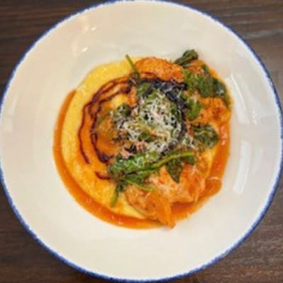 Tomato Braised Chicken Thighs over Creamy Polenta Tomato Braised Chicken Thighs over Creamy Polenta