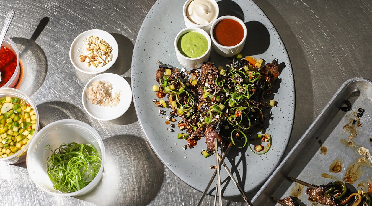 Short Rib Satay with Trio of Sauces, Pickled Cucumber and Crispy Black Rice – - Recipe