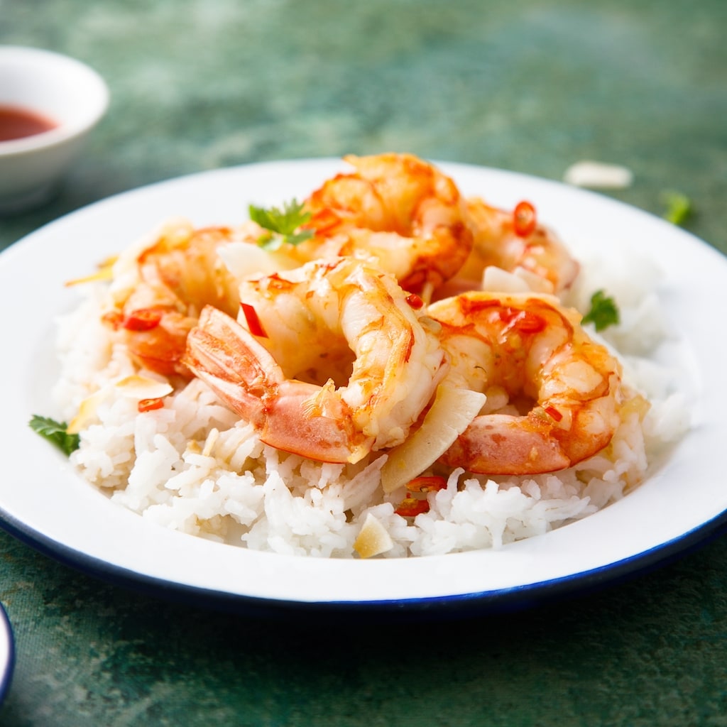 Roasted shrimps with coconut and rice; Shutterstock ID 2084144944; purchase_order: 20210819; job: UFS NAM // Spanish Microsite; client: UFS NAM; other: DMM_Maxim